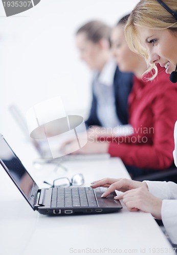 Image of business woman group with headphones