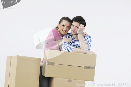 Image of Young couple moving in new home