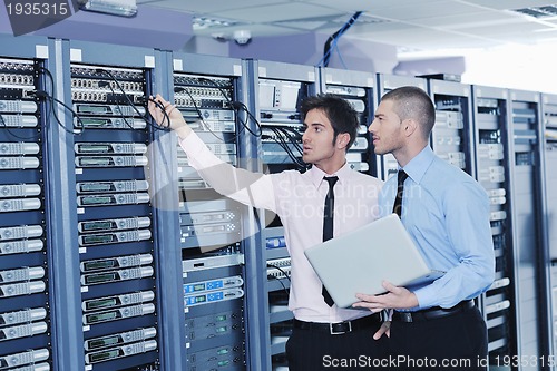 Image of it enineers in network server room