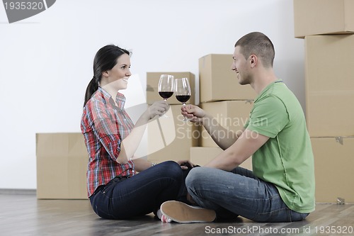 Image of Young couple moving in new home