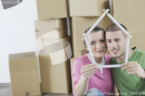 Image of Young couple moving in new home