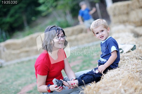 Image of woman and child have fun outdoor