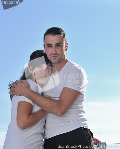 Image of couple relaxing on balcony
