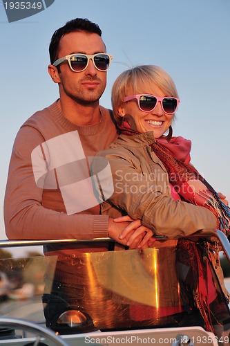 Image of couple in love  have romantic time on boat