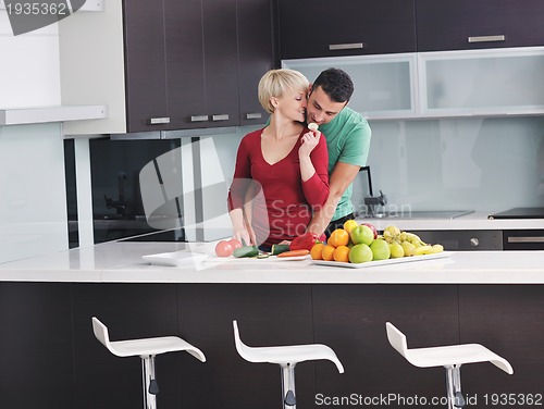 Image of young couple have fun in modern kitchen