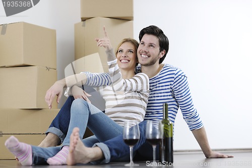 Image of Young couple moving in new home