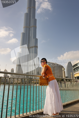 Image of happy tourist woman