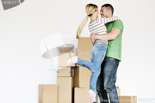 Image of Young couple moving in new house