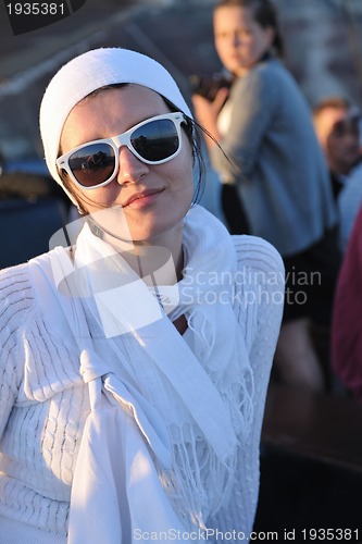 Image of Greek woman on the streets of Oia, Santorini, Greece