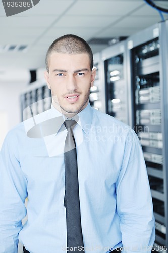 Image of young it engeneer in datacenter server room