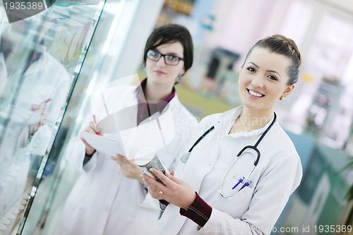 Image of team of pharmacist chemist woman  in pharmacy drugstore