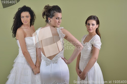 Image of portrait of a three beautiful woman in wedding dress