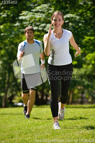 Image of Young couple jogging