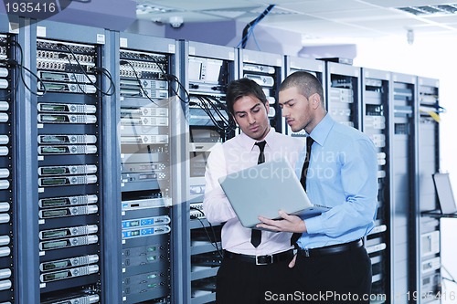 Image of it enineers in network server room