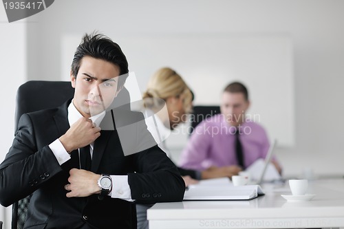 Image of young business man at meeting