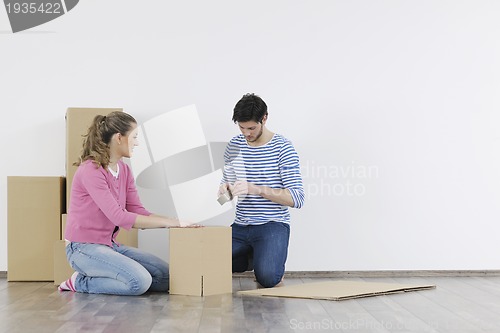 Image of Young couple moving in new home