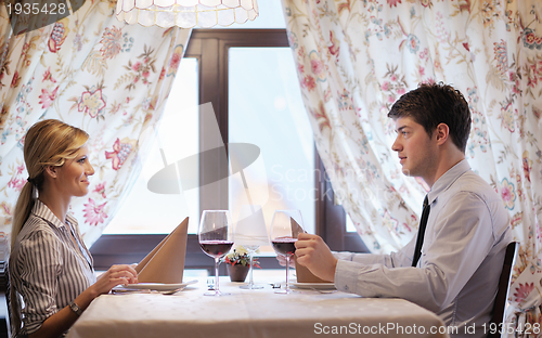 Image of young couple having dinner at a restaurant