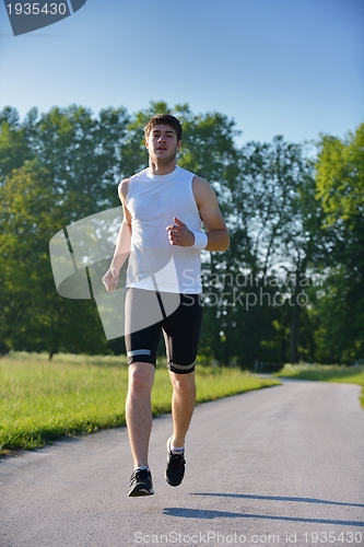 Image of Young couple jogging at morning