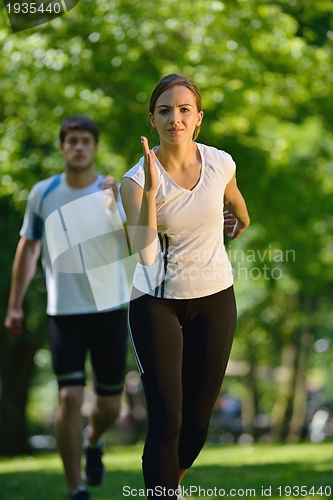 Image of Young couple jogging