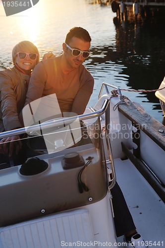 Image of couple in love  have romantic time on boat