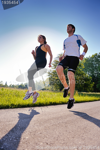 Image of Young couple jogging