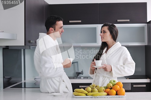 Image of young couple have fun in modern kitchen