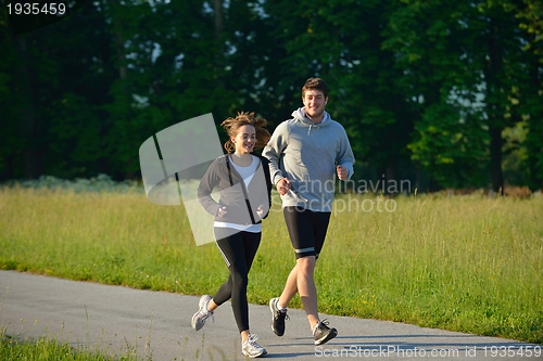 Image of Young couple jogging