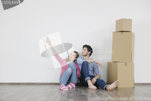 Image of Young couple moving in new home