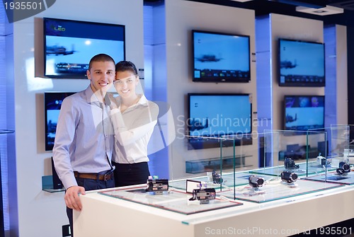 Image of people buy  in consumer electronics store