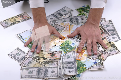 Image of Business man holding money