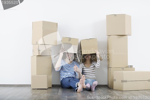 Image of Young couple moving in new home