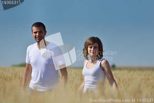 Image of happy couple in wheat field