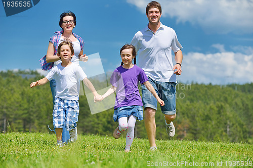 Image of happy young family have fun outdoors