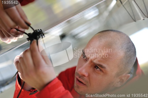 Image of Male solar panel engineer at work place