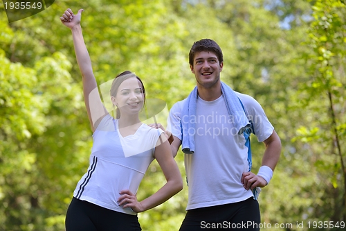 Image of Young couple jogging