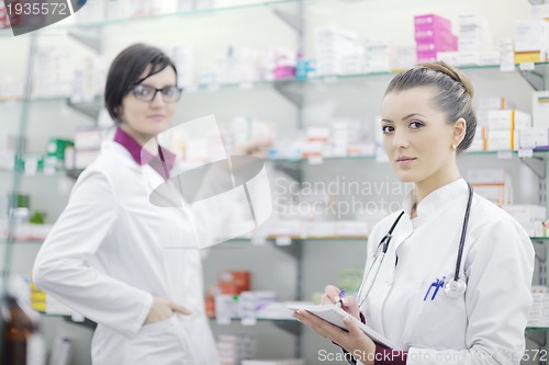 Image of team of pharmacist chemist woman  in pharmacy drugstore