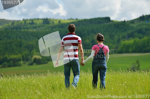 Image of romantic young couple in love together outdoor