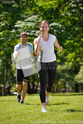 Image of Young couple jogging