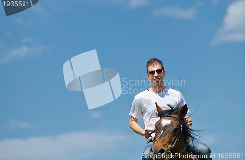 Image of man ride horse