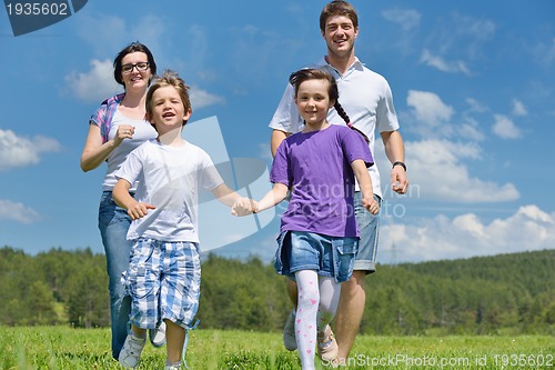 Image of happy young family have fun outdoors