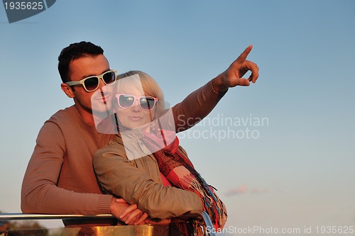 Image of couple in love  have romantic time on boat