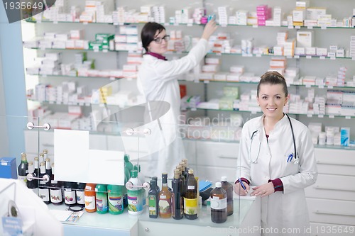 Image of team of pharmacist chemist woman  in pharmacy drugstore