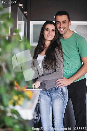 Image of young couple have fun in modern kitchen