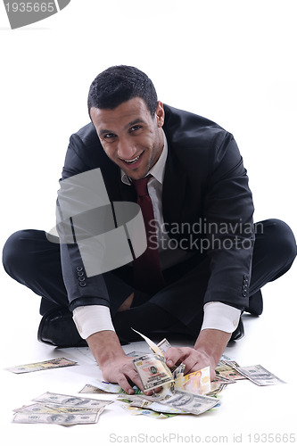 Image of Business man holding money