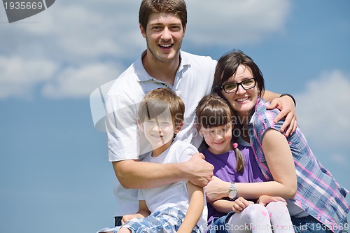 Image of happy young family have fun outdoors