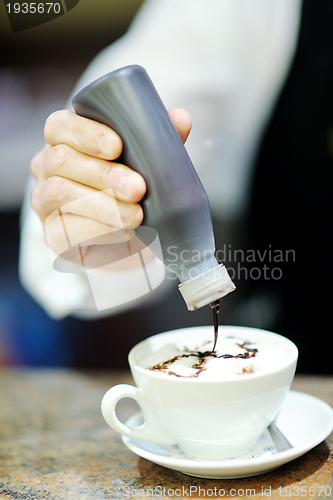 Image of Barista prepares cappuccino