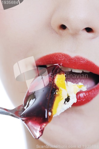 Image of beautiful young woman eat sweet cake