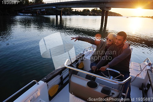 Image of couple in love  have romantic time on boat