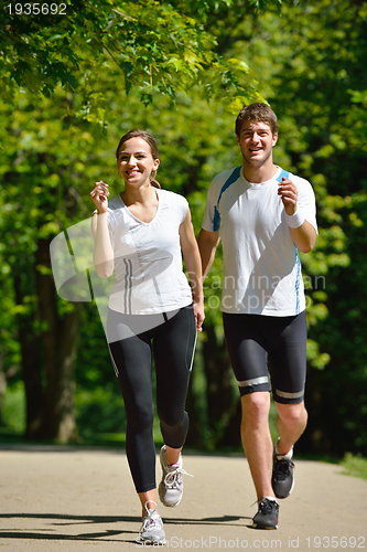 Image of Young couple jogging