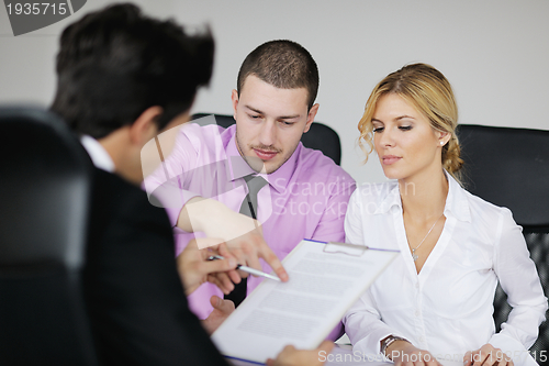 Image of Group of young business people at meeting